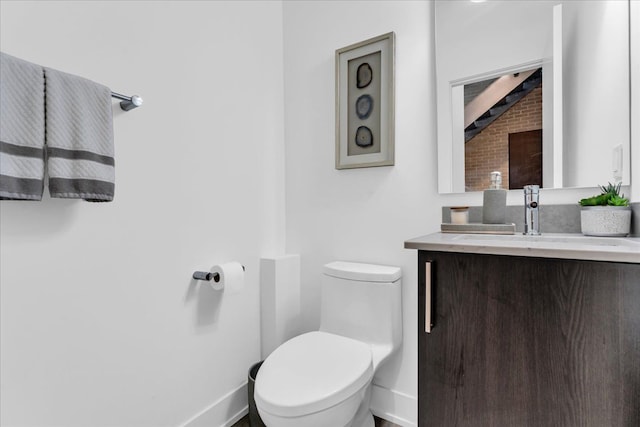 248 Alfred St, Detroit, MI 48201 - bathroom with toilet, baseboards, and vanity