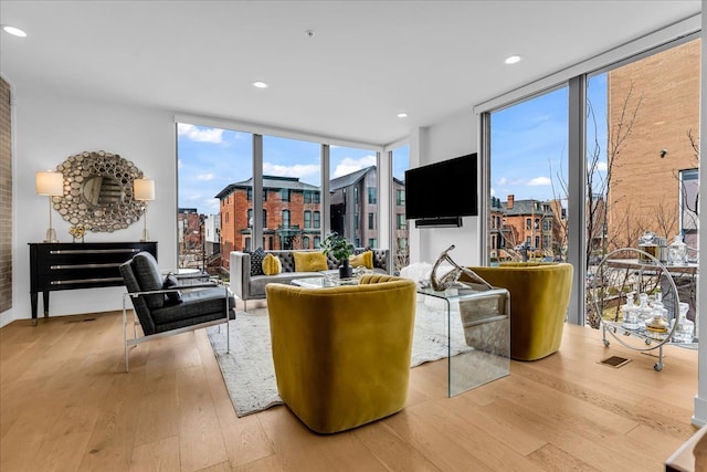 248 Alfred St, Detroit, MI 48201 - living room with recessed lighting, floor to ceiling windows, a wealth of natural light, and light wood-type flooring