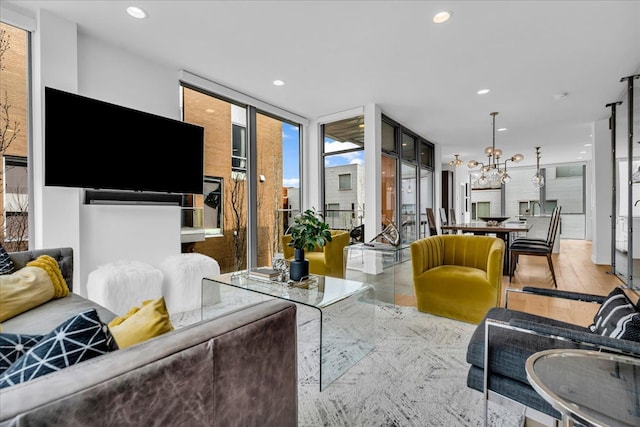 248 Alfred St, Detroit, MI 48201 - living room featuring recessed lighting, floor to ceiling windows, and an inviting chandelier