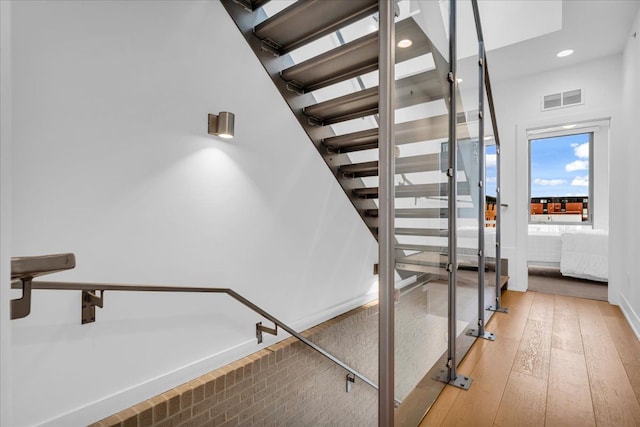 248 Alfred St, Detroit, MI 48201 - stairs with recessed lighting, visible vents, and hardwood / wood-style floors