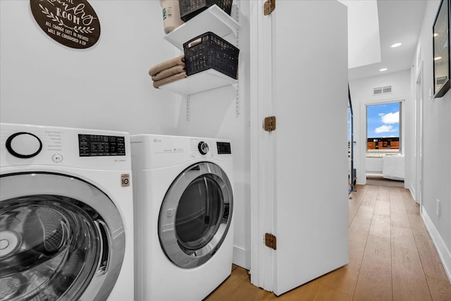 248 Alfred St, Detroit, MI 48201 - laundry room featuring visible vents, laundry area, washer and dryer, recessed lighting, and light wood-style flooring