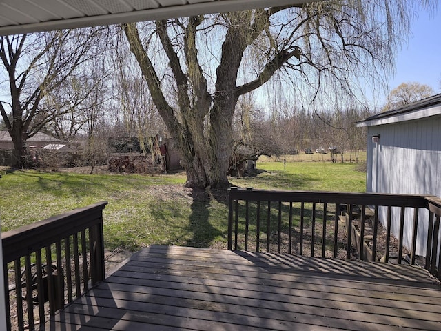 wooden terrace with a lawn