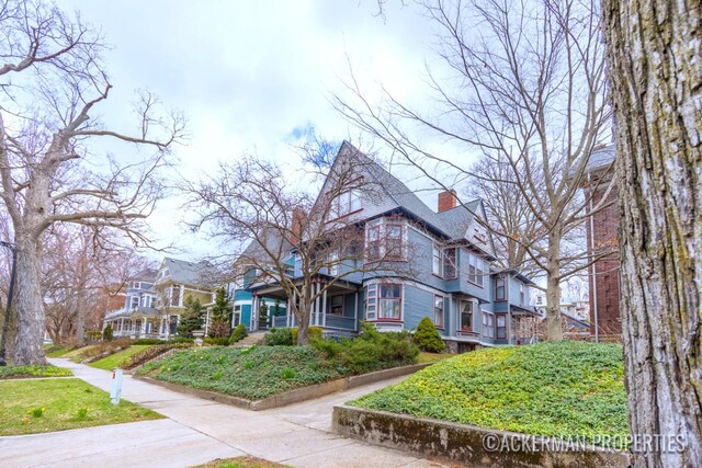 234 Madison Ave SE, Grand Rapids, MI 49503 - view of front of house with a chimney
