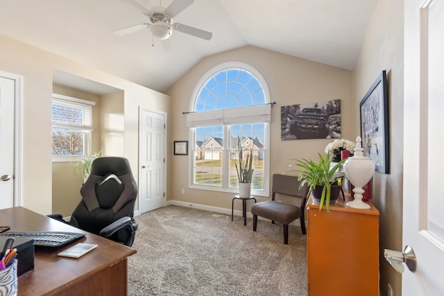 office with carpet flooring, ceiling fan, vaulted ceiling, and a healthy amount of sunlight