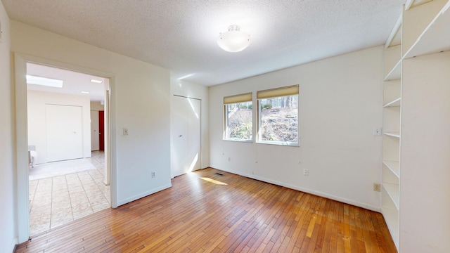 3375 Riverbend Dr, Ann Arbor, MI 48105 - empty room featuring light wood-style floors and baseboards