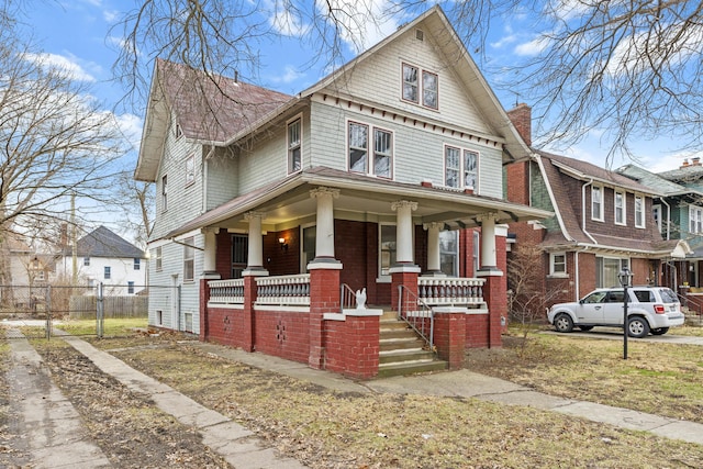 250 Alger St, Detroit, MI 48202 - american foursquare style home with a porch, fence, and a gate