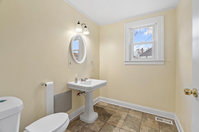 250 Alger St, Detroit, MI 48202 - half bathroom with toilet, baseboards, ornamental molding, and visible vents