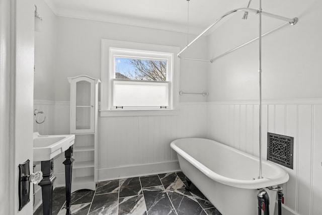 250 Alger St, Detroit, MI 48202 - bathroom with a freestanding tub, wainscoting, and marble finish floor