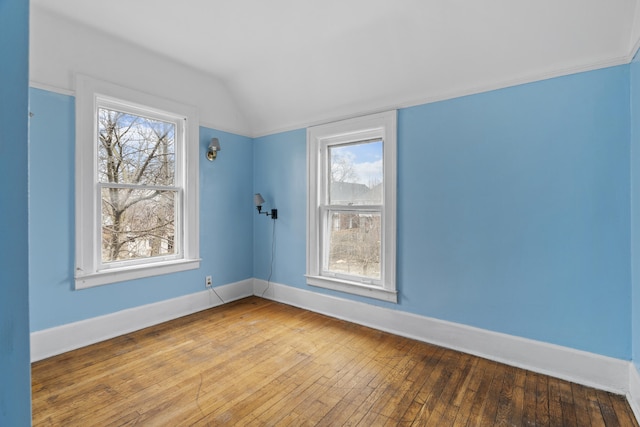250 Alger St, Detroit, MI 48202 - unfurnished room featuring baseboards, hardwood / wood-style flooring, and lofted ceiling