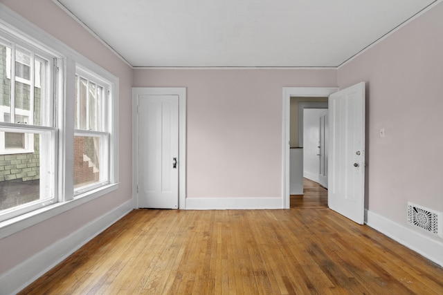 250 Alger St, Detroit, MI 48202 - spare room featuring crown molding, visible vents, baseboards, and light wood finished floors