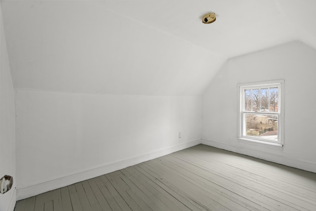 250 Alger St, Detroit, MI 48202 - bonus room featuring baseboards, hardwood / wood-style flooring, and vaulted ceiling