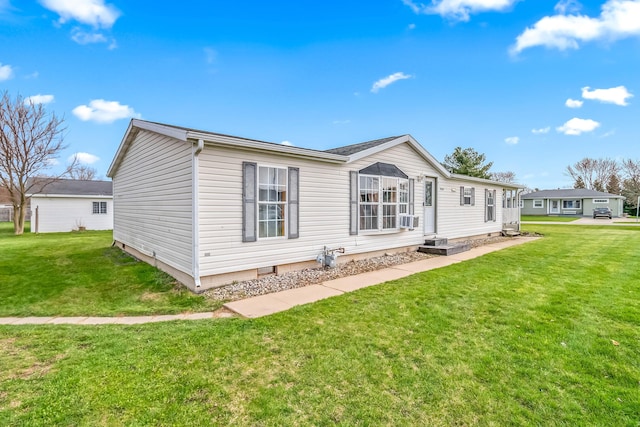 view of front of property featuring cooling unit and a front lawn