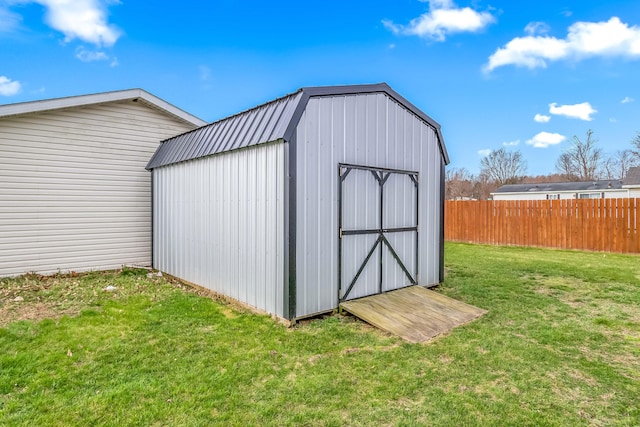 view of shed with fence