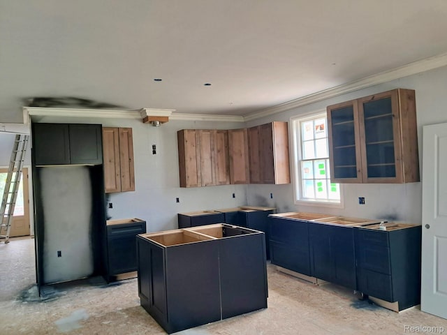 8475 Stout Ave, Warren, MI 48093 - kitchen with crown molding, a kitchen island, glass insert cabinets, and brown cabinetry