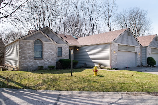 ranch-style house with a front yard, brick siding, driveway, and a garage