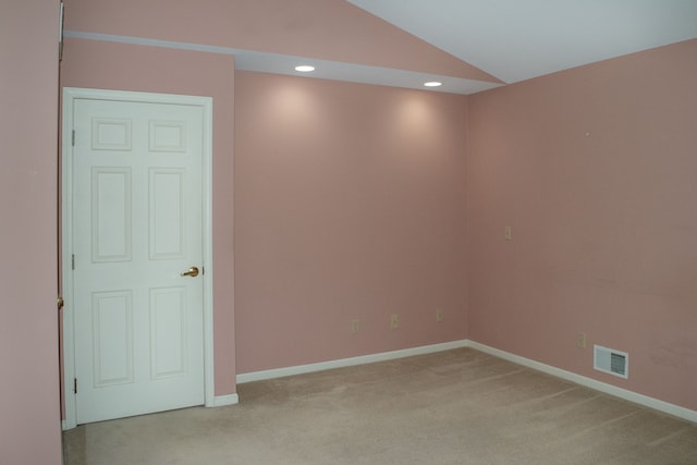 empty room featuring visible vents, baseboards, light carpet, lofted ceiling, and recessed lighting