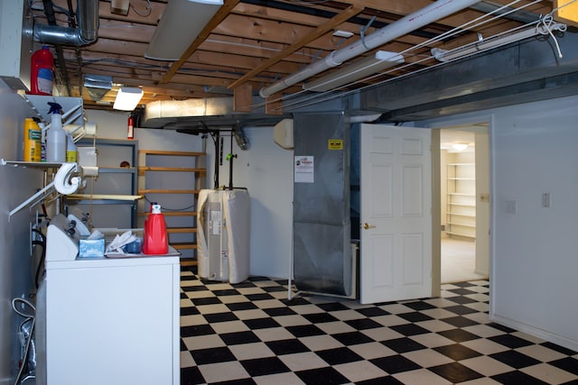below grade area with tile patterned floors, water heater, washing machine and dryer, and heating unit