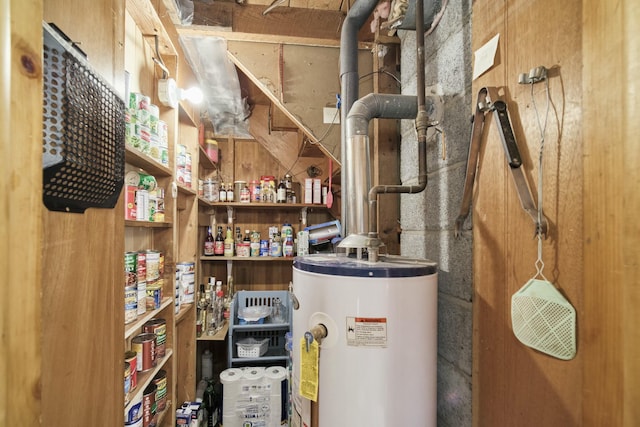 utility room featuring water heater