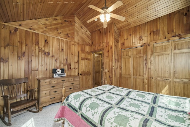 bedroom with wooden walls, wood ceiling, vaulted ceiling, and a ceiling fan