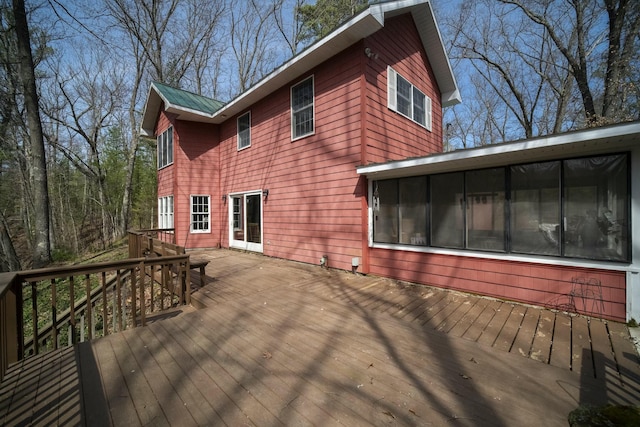 wooden terrace featuring a sunroom