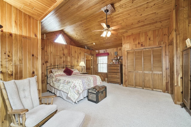 carpeted bedroom with wood walls, wood ceiling, a closet, and lofted ceiling
