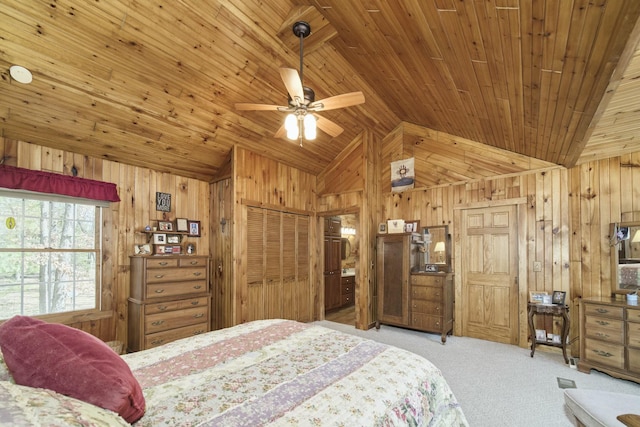 bedroom with wooden ceiling, wooden walls, carpet flooring, and lofted ceiling