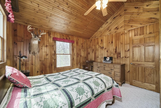 carpeted bedroom with wooden walls, a ceiling fan, lofted ceiling, and wood ceiling
