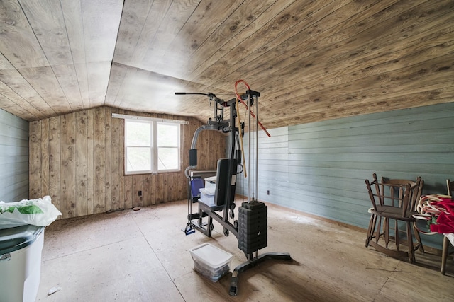 exercise area featuring wooden walls, wood ceiling, and lofted ceiling