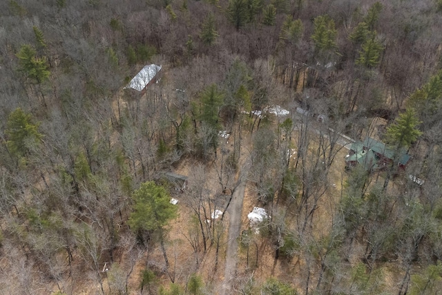 drone / aerial view featuring a view of trees