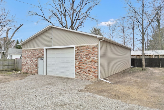 3628 Ford Ave, Jackson, MI 49203 - garage featuring fence and driveway