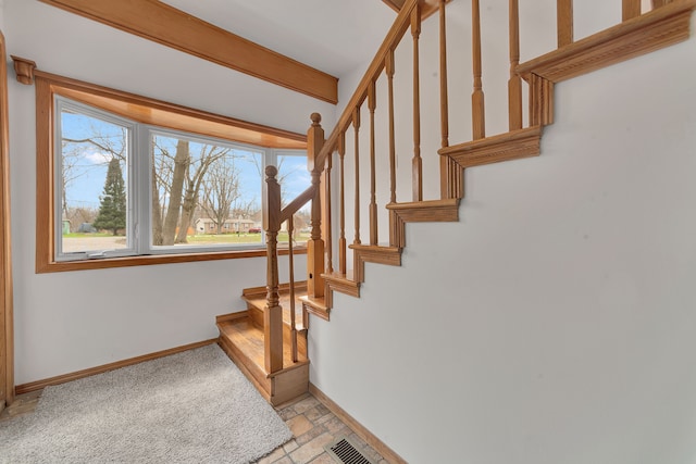 3628 Ford Ave, Jackson, MI 49203 - staircase featuring visible vents, stone finish flooring, and baseboards