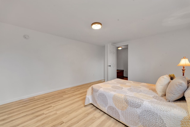3628 Ford Ave, Jackson, MI 49203 - bedroom featuring baseboards and light wood-style floors