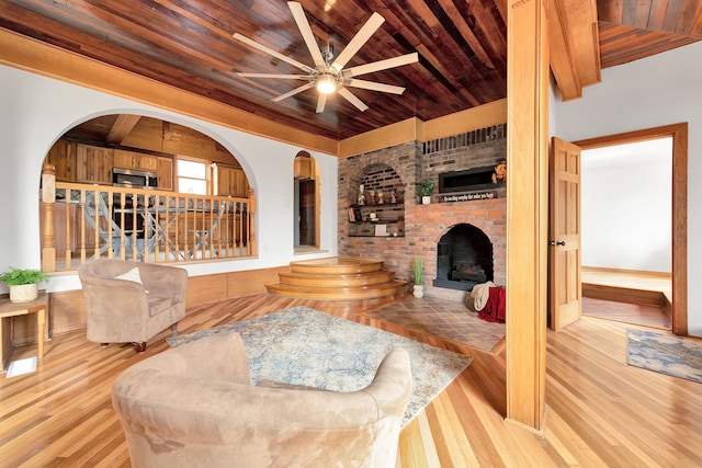 3628 Ford Ave, Jackson, MI 49203 - living room featuring a fireplace, wood finished floors, a ceiling fan, and wooden ceiling