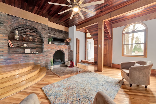 3628 Ford Ave, Jackson, MI 49203 - living area featuring hardwood / wood-style flooring, wooden ceiling, a ceiling fan, and a fireplace