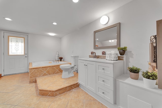 3628 Ford Ave, Jackson, MI 49203 - bathroom featuring a garden tub, vanity, toilet, tile patterned flooring, and recessed lighting