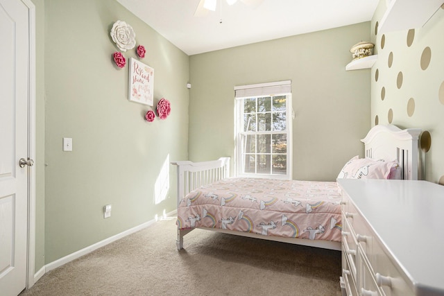carpeted bedroom with baseboards and ceiling fan