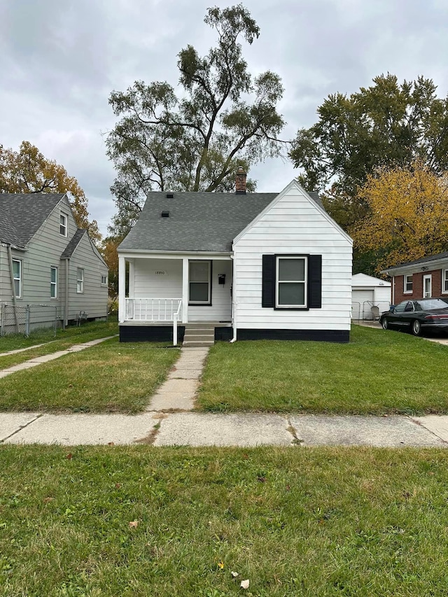 18850 Dalby, Redford, MI 48240 - bungalow-style home featuring roof with shingles, a chimney, covered porch, and a front lawn