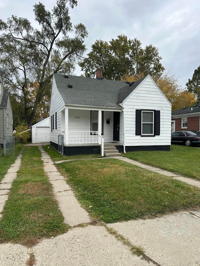 18850 Dalby, Redford, MI 48240 - view of front of house featuring a garage, covered porch, a front yard, a chimney, and a shingled roof
