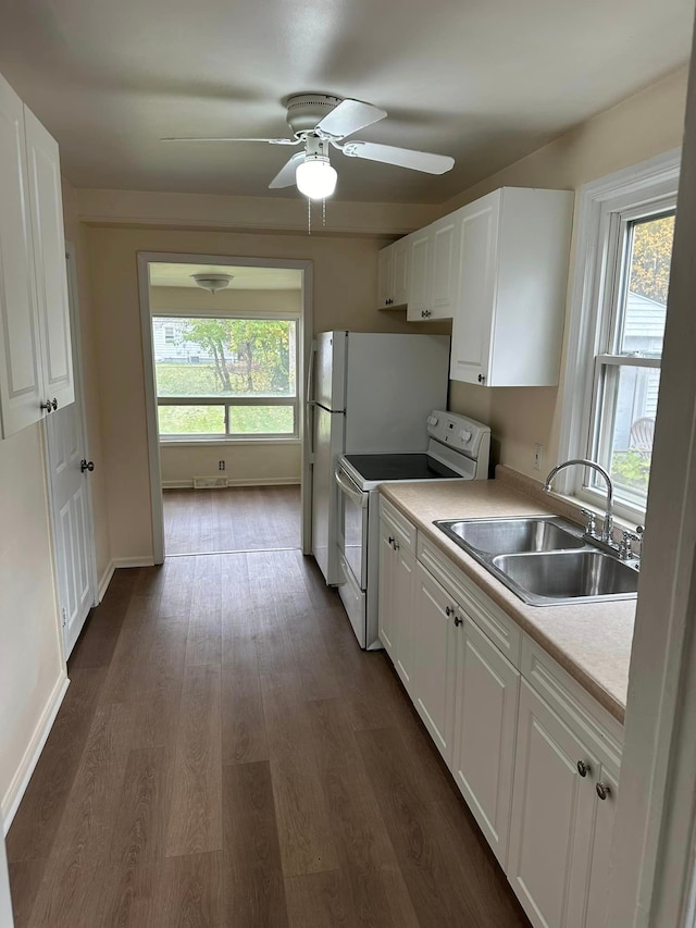18850 Dalby, Redford, MI 48240 - kitchen with ceiling fan, dark wood-type flooring, white cabinets, white range with electric stovetop, and a sink