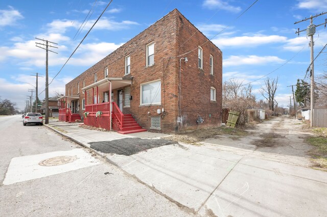 view of front of house with brick siding