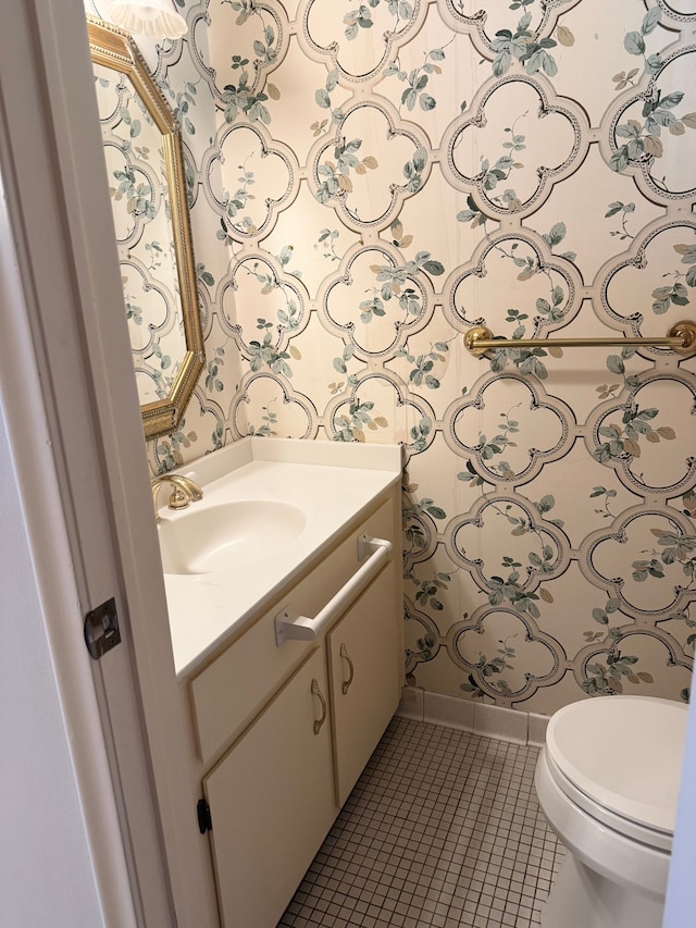 5959 Alan Dr Unit 57, Brighton, MI 48116 - half bathroom with vanity, baseboards, wallpapered walls, tile patterned flooring, and toilet