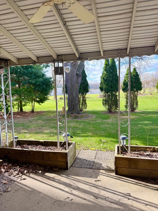5959 Alan Dr Unit 57, Brighton, MI 48116 - view of patio / terrace featuring a vegetable garden