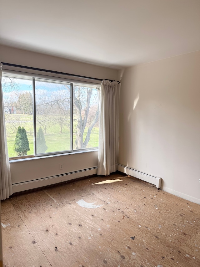5959 Alan Dr Unit 57, Brighton, MI 48116 - unfurnished room with a baseboard radiator and a wealth of natural light