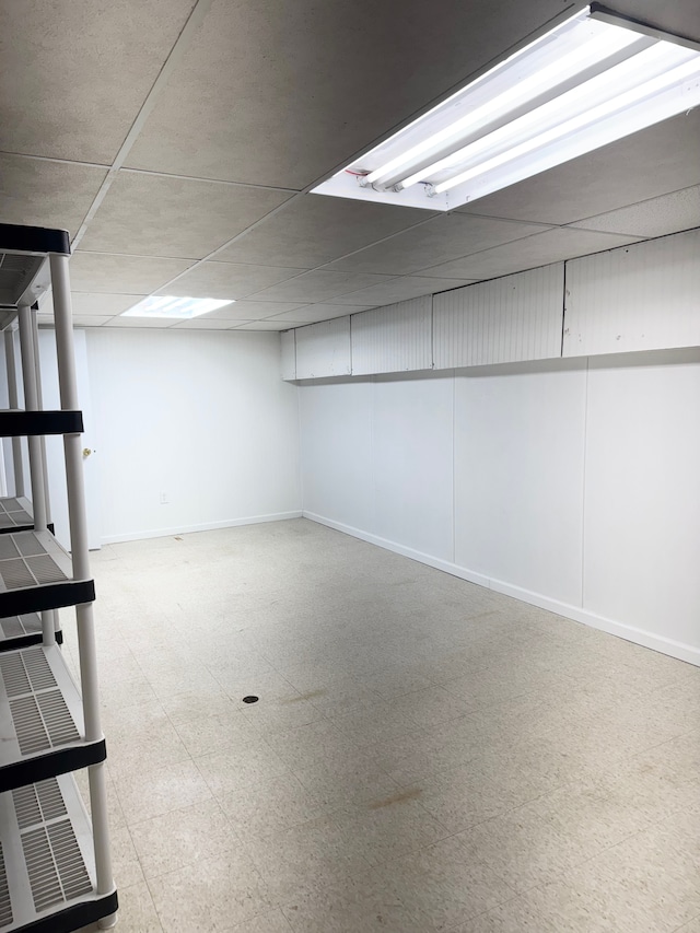 5959 Alan Dr Unit 57, Brighton, MI 48116 - finished below grade area with tile patterned floors and baseboards