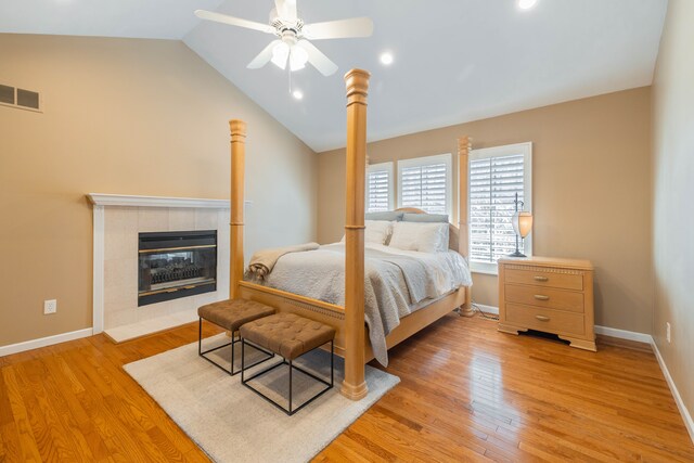 7837 Oak River Dr, Grosse Ile, MI 48138 - bedroom featuring light wood finished floors, baseboards, lofted ceiling, and visible vents