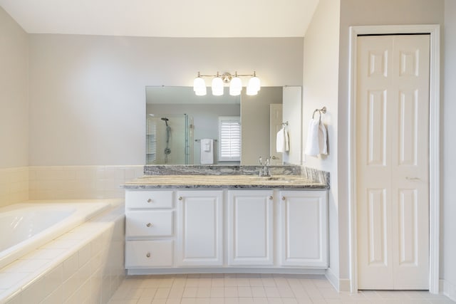 7837 Oak River Dr, Grosse Ile, MI 48138 - full bathroom with a bath, a closet, vanity, a stall shower, and tile patterned floors