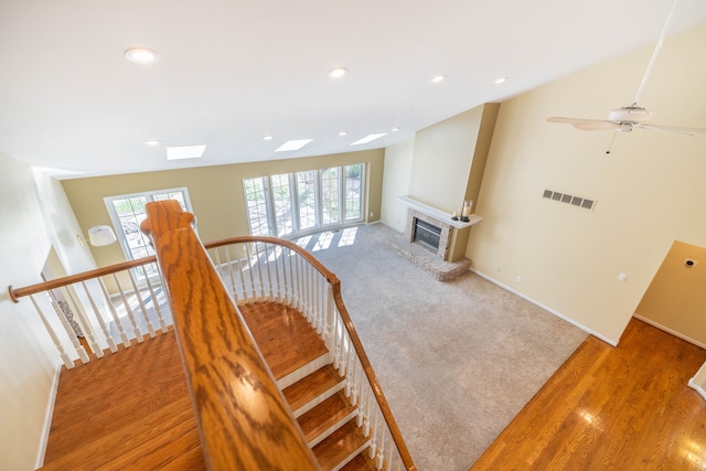 7837 Oak River Dr, Grosse Ile, MI 48138 - staircase with baseboards, a fireplace, visible vents, and recessed lighting