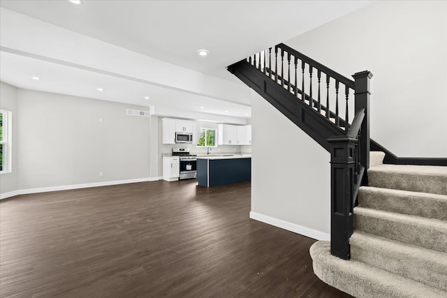 592 Leicester, Detroit, MI 48202 - staircase with wood finished floors, baseboards, and recessed lighting