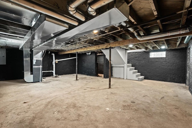 592 Leicester, Detroit, MI 48202 - below grade area featuring heating unit, stairs, and electric panel