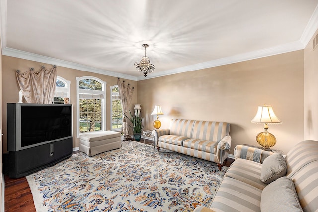 2434 Pebble Beach Dr, Oakland, MI 48363 - living area with a notable chandelier, baseboards, crown molding, and wood finished floors